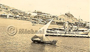Arab Dhow and British Cablelayer at Aden Port